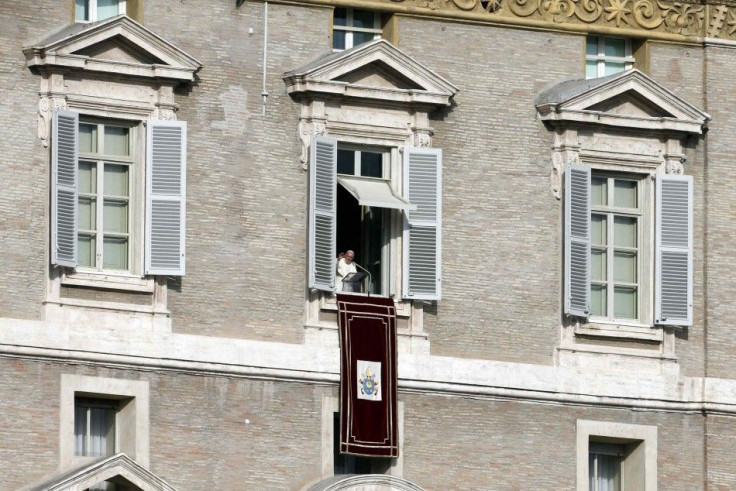 Pope Francis leads the Angelus prayer from the window of the Apostolic Palace in Saint Peter's Square at the Vatican