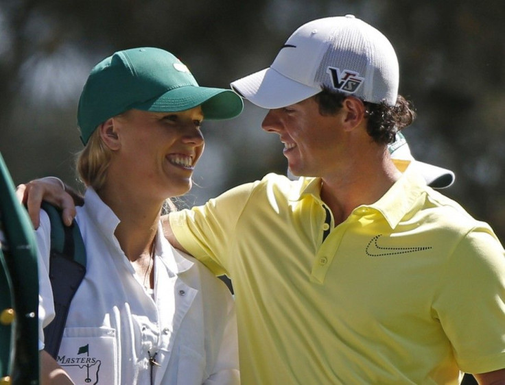 File photo of McIlroy of Northern Ireland and his girlfriend, tennis player Wozniacki of Denmark, during the annual Masters Par 3 Contest in Augusta (Reuters)