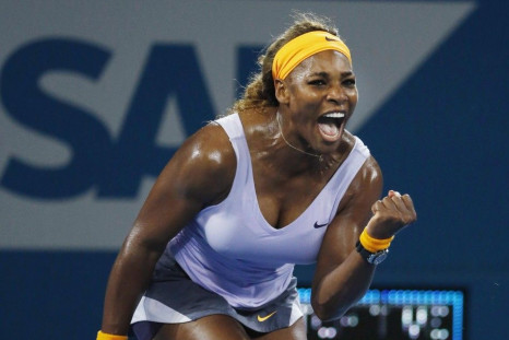 Williams of U.S. reacts as she wins point against Sharapova of Russia during women's singles semi-finals match at Brisbane International tennis tournament in Brisbane