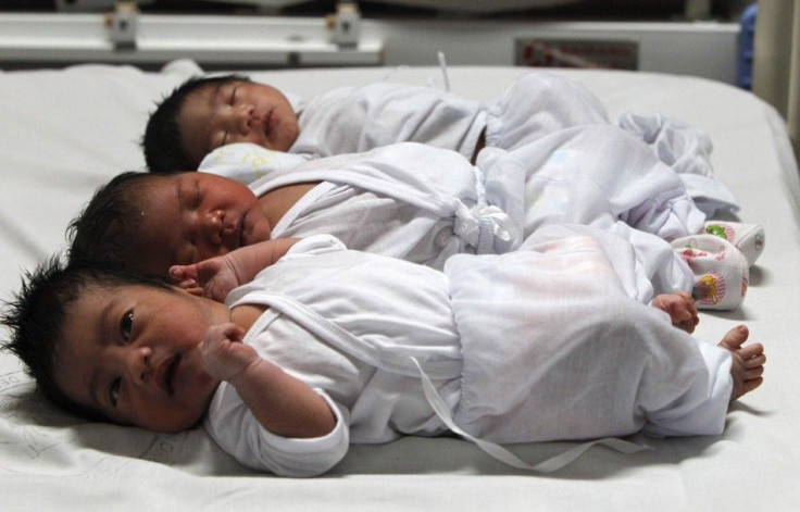 Babies who were born on New Year's day, lie on a bed inside the maternity ward of the Jose Reyes Memorial hospital in Manila January 1, 2014. At least three babies were born on New Year's day at the Jose Reyes Memorial hospital, according to hospital offi