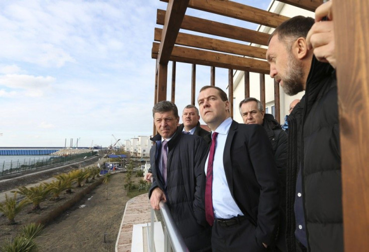 Dmitry Medvedev, Oleg Deripaska, and Dmitry Kozak inspect the Olympic Village