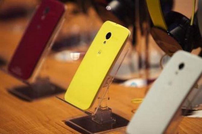 Different Colored Examples of Motorola's New Moto X Phones Rest on a Table at a Launch Event in New York