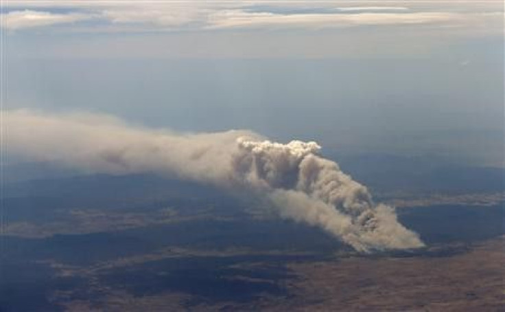 Smoke rises from the Yarrabin bushfire, burning out of control near Cooma, about 100km (62 miles) south of Canberra January 8, 2013.