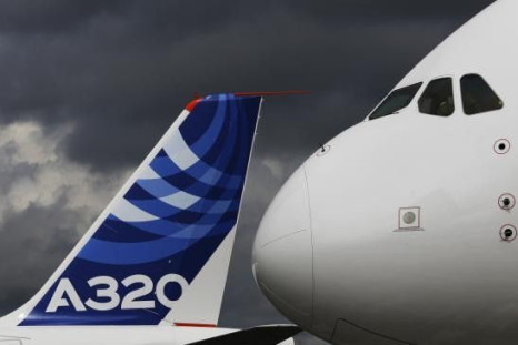 File photograph shows the nose cone of an Airbus A380 next to the tail fin of an Airbus A320 at the Farnborough Airshow 2012 in southern England July 10, 2012.