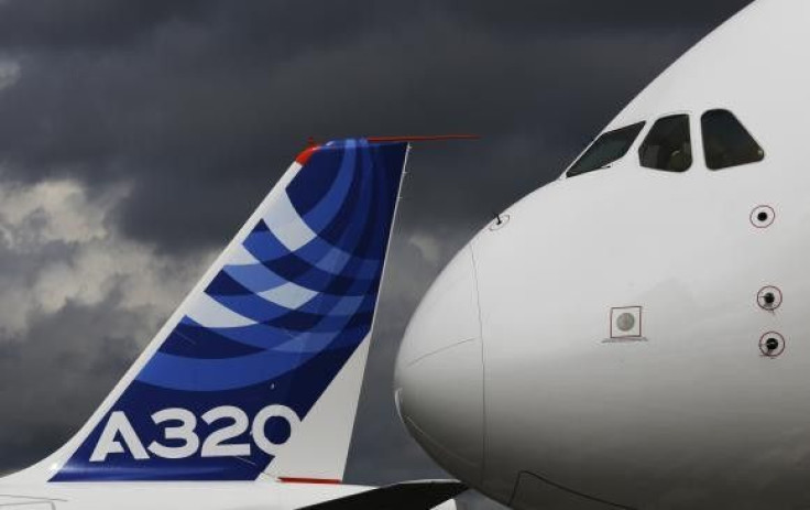 File photograph shows the nose cone of an Airbus A380 next to the tail fin of an Airbus A320 at the Farnborough Airshow 2012 in southern England July 10, 2012.