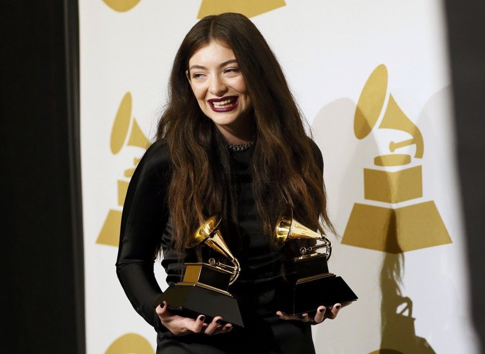 Pop singer Lorde poses backstage with her awards for song of the year for quotRoyalsquot and best pop solo performance for quotRoyalsquot at the 56th annual Grammy Awards in Los Angeles, California 
