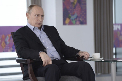 Russian President Vladimir Putin listens to a journalist&#039;s question during a televised news conference in Sochi January 19, 2014.