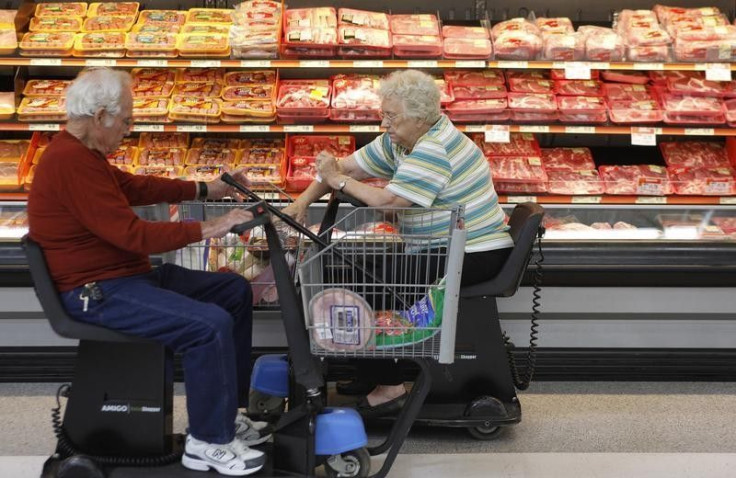 Customers shop for meat at Wal-Mart in Rogers, Arkansas, June 4, 2009. REUTERS/Jessica Rinaldi