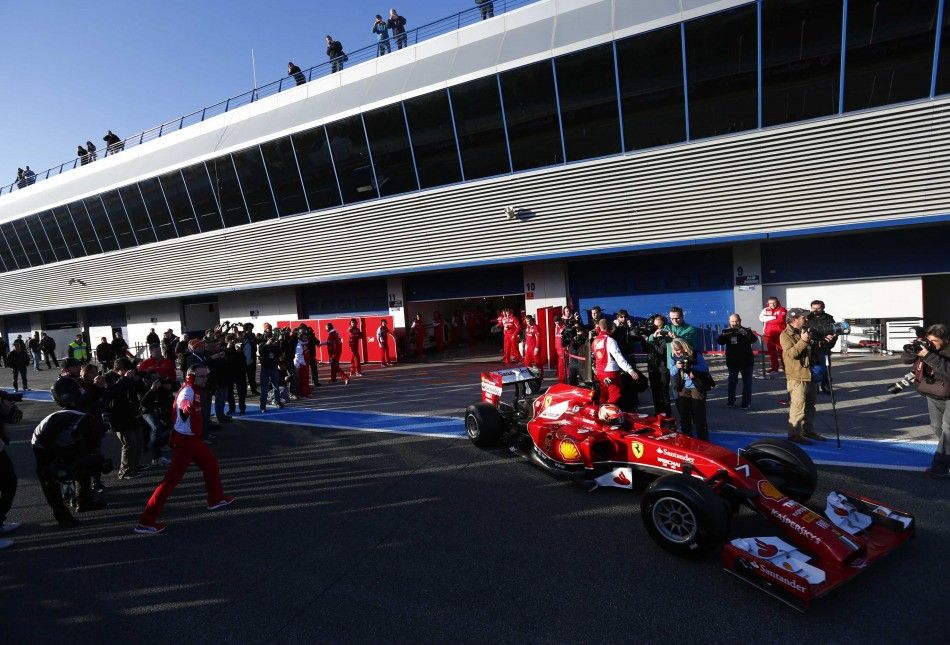 Ferrari Formula One racing driver Kimi Raikkonen of Finland drives the new F14 T during pre-season testing at the Jerez racetrack