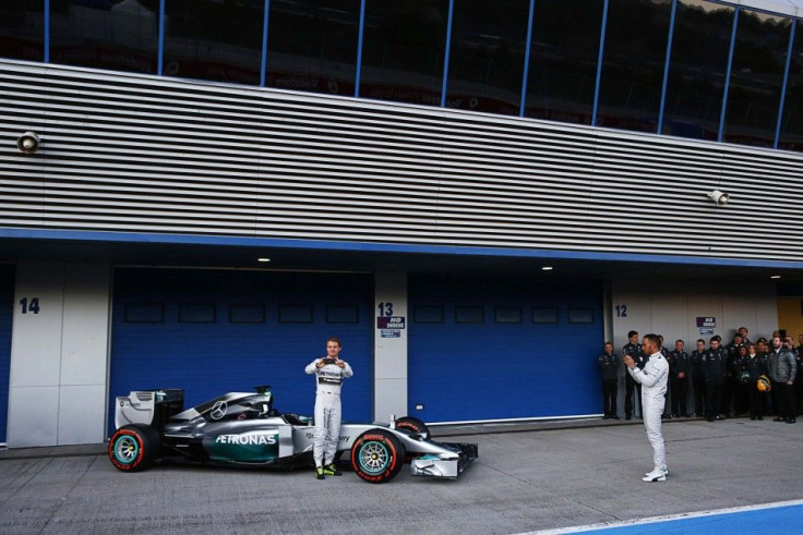 Mercedes Formula One racing driver Hamilton of Britain and teammate Rosberg of Germany take part in the official presentation of the new Mercedes F1 W05 car at the Jerez racetrack in southern Spain