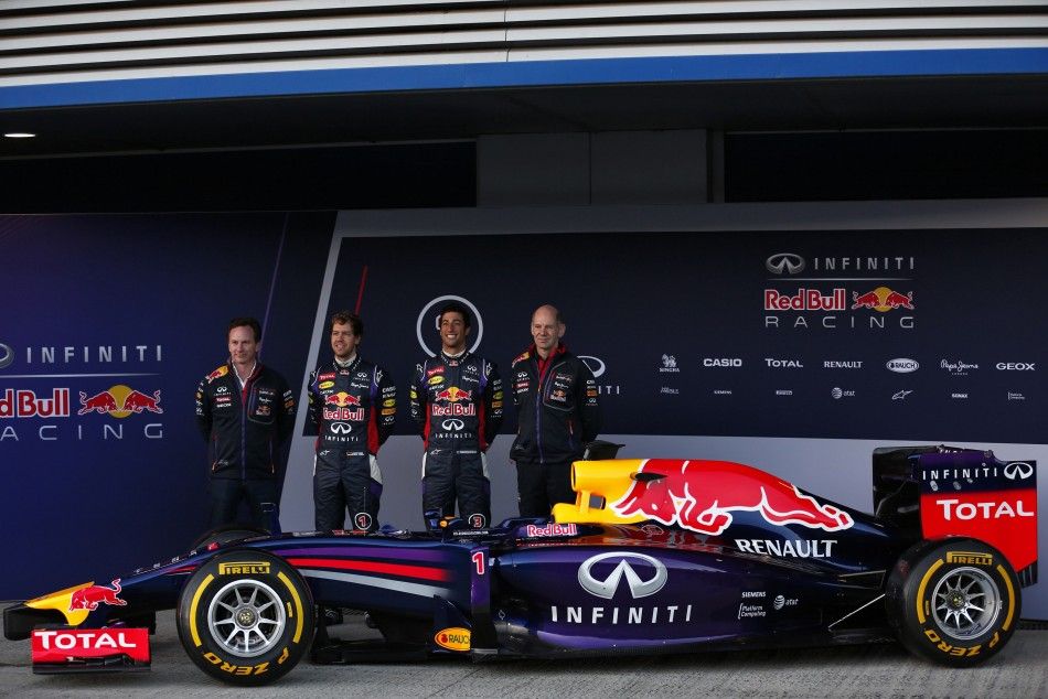 Red Bull Formula One drivers Vettel of Germany and Ricciardo of Australia, team principal Horner and technical chief Newey pose with the new RB10 at the Jerez racetrack in southern Spain