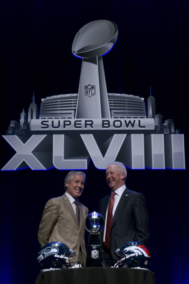 Seattle Seahawks head coach Pete Carroll and Denver Broncos coach John Fox pose with The Vince Lombardi trophy during a news conference ahead of Super Bowl XLVIII in New York