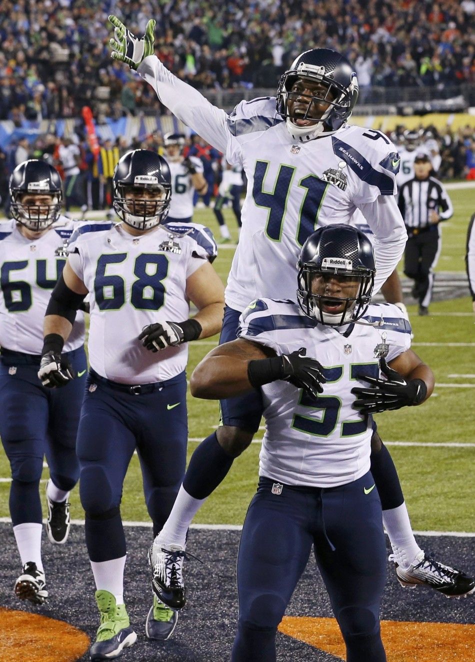Seahawks Smith celebrates a touchdown with teammate Maxwell against the Broncos during the NFL Super Bowl XLVIII football game in East Rutherford