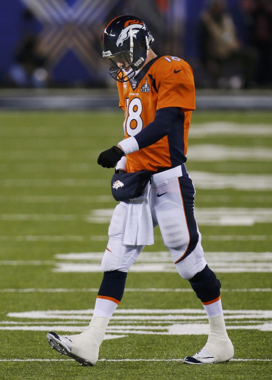 Broncos quarterback Manning walks off the field after a set of downs against the Seattle Seahawks in the during the NFL Super Bowl XLVIII football game in East Rutherford