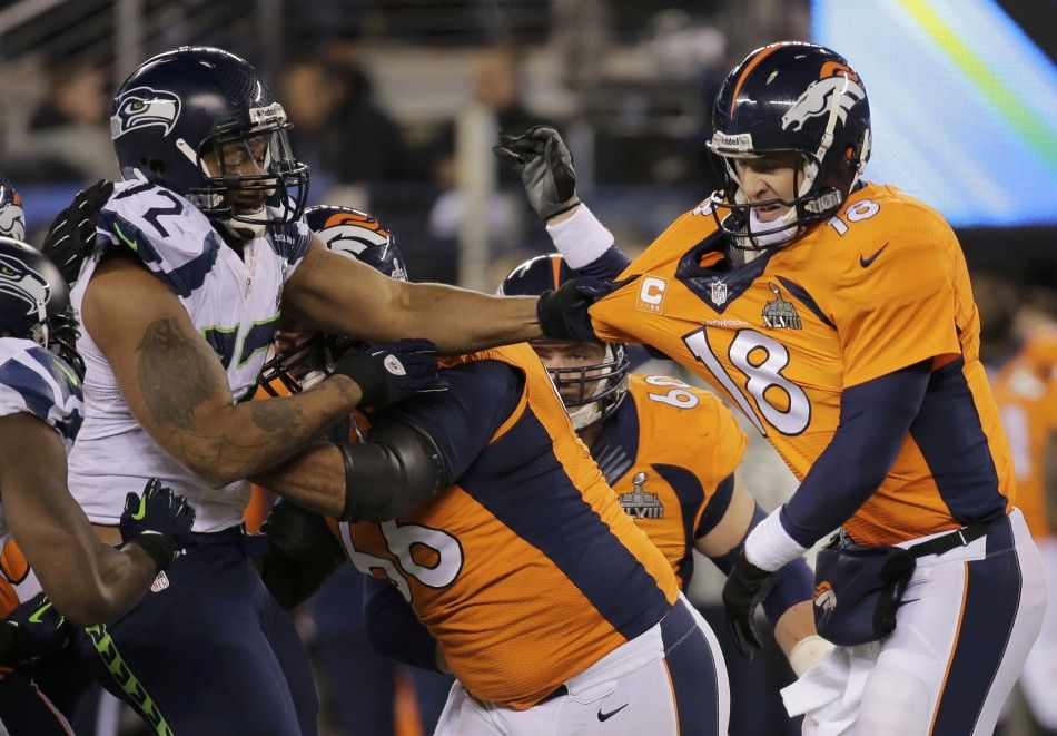 Seahawks Bennett grabs the jersey of Broncos quarterback Manning during the NFL Super Bowl XLVIII football game in East Rutherford