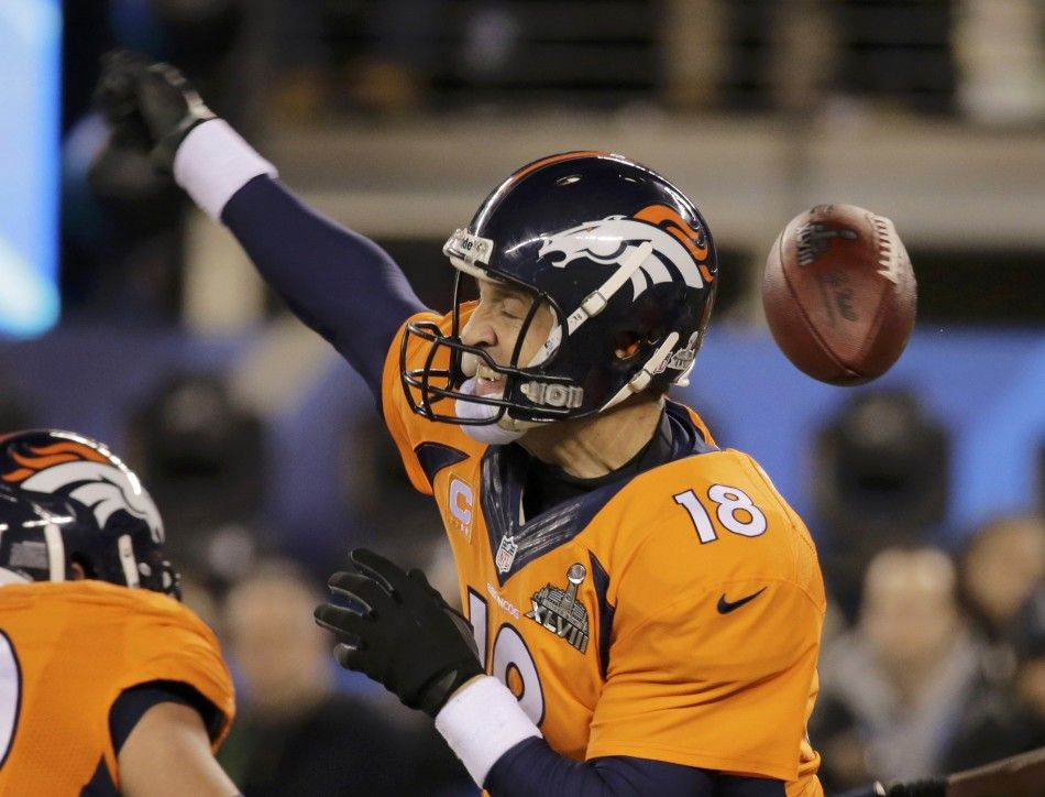 Denver Broncos quarterback Peyton Manning is stripped of the ball during the fourth quarter against the Seattle Seahawks in the NFL Super Bowl XLVIII in East Rutherford