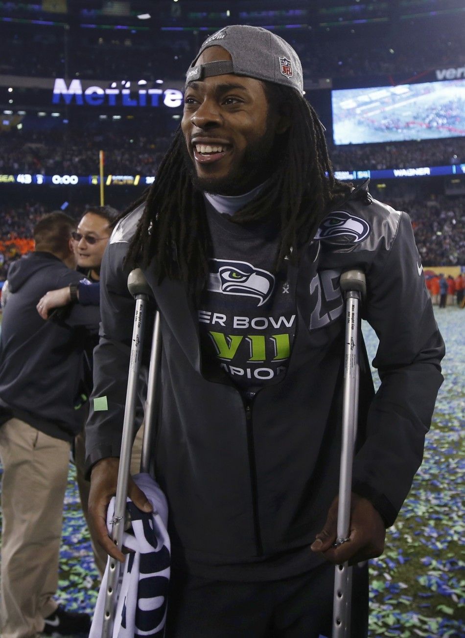 Seattle Seahawks Richard Sherman walks on crutches after the Seahawks defeated the Denver Broncos in the NFL Super Bowl XLVIII