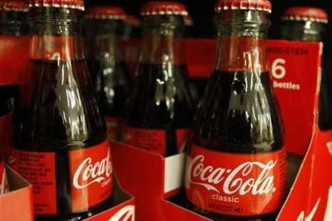Bottles of Coca-Cola sit on a supermarket shelf in Gilbert, Arizona October 20, 2009.