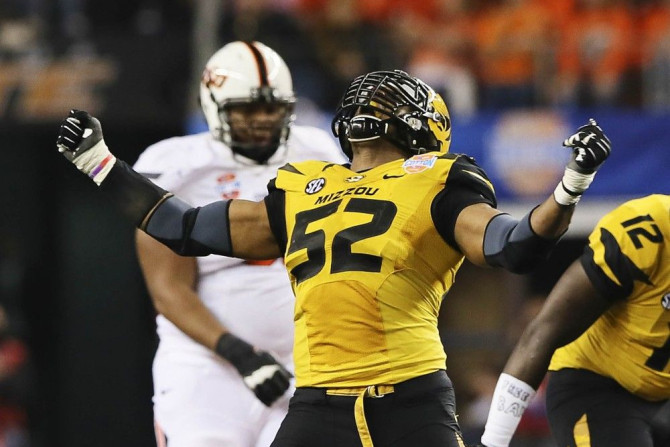 Missouri Tigers defensive lineman Michael Sam (52) reacts after a play during the second half against the Oklahoma State Cowboys in the 2014 Cotton Bowl at AT&T Stadium in Arlington