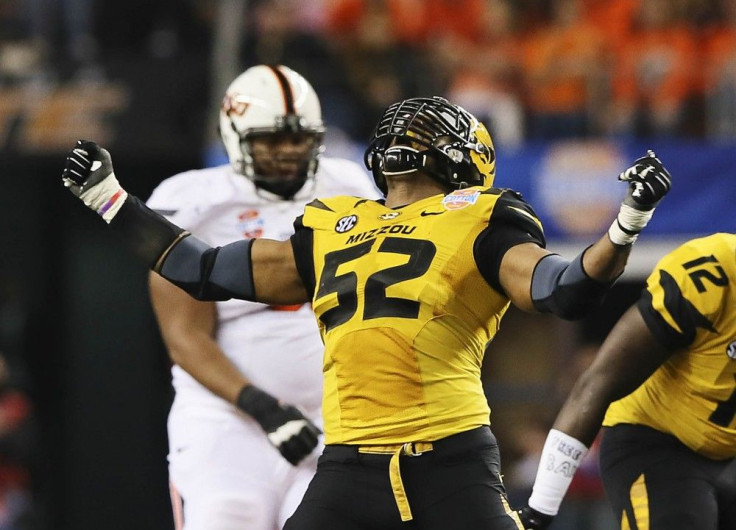 Missouri Tigers defensive lineman Michael Sam (52) reacts after a play during the second half against the Oklahoma State Cowboys in the 2014 Cotton Bowl at AT&T Stadium in Arlington