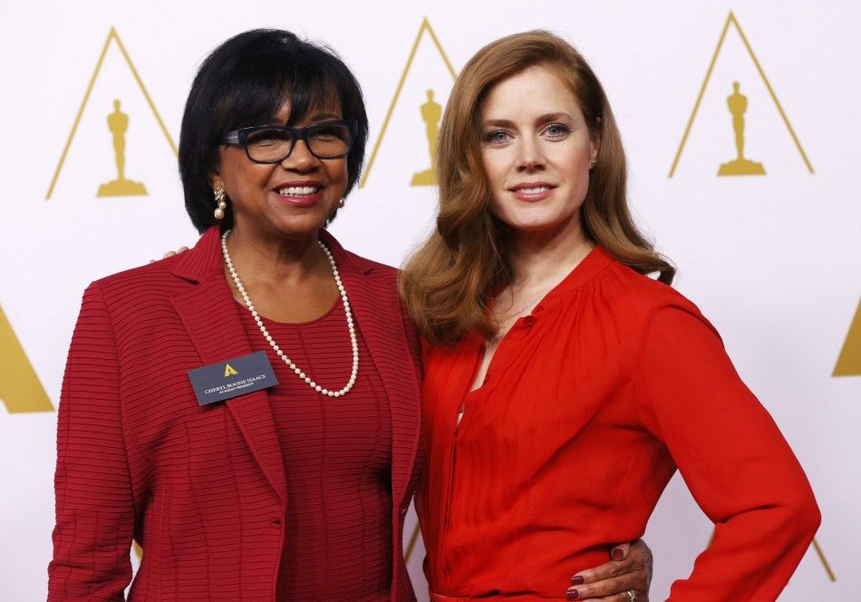 Cheryl Boone Isaacs poses with Amy Adams at the 86th Academy Awards nominees luncheon in Beverly Hills