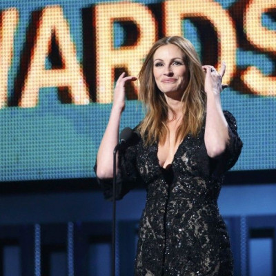 Actress Julia Roberts introduces a performance by Paul McCartney and Ringo Starr at the 56th annual Grammy Awards in Los Angeles