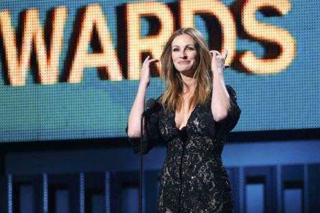 Actress Julia Roberts introduces a performance by Paul McCartney and Ringo Starr at the 56th annual Grammy Awards in Los Angeles