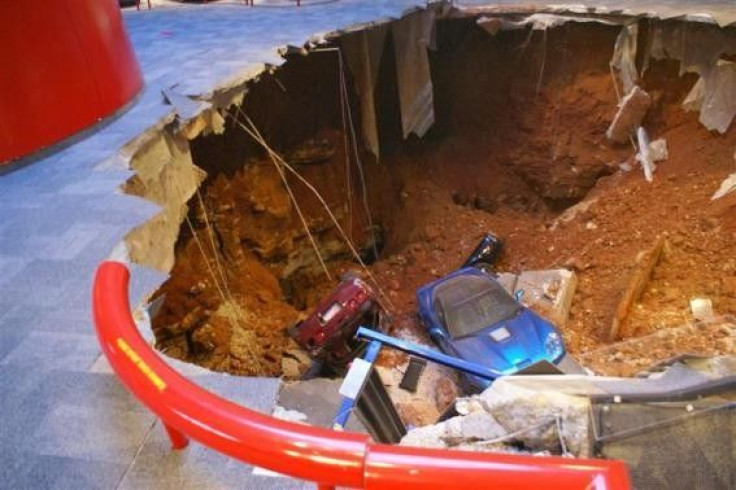 A 40-foot sinkhole that opened up under the National Corvette Museum and swallowed eight Corvettes, including the historic 1992 White 1 Millionth Corvette, in Bowling Green, Kentucky February 12, 2014 is seen in this handout provided by the museum.