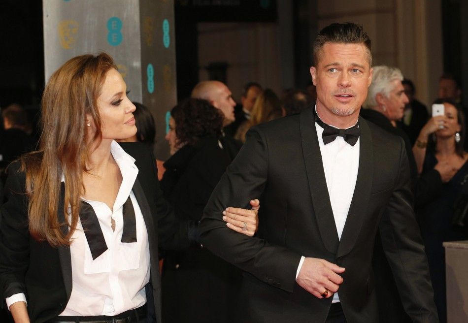 Actors Brad Pitt and Angelina Jolie arrive at the British Academy of Film and Arts awards ceremony in London