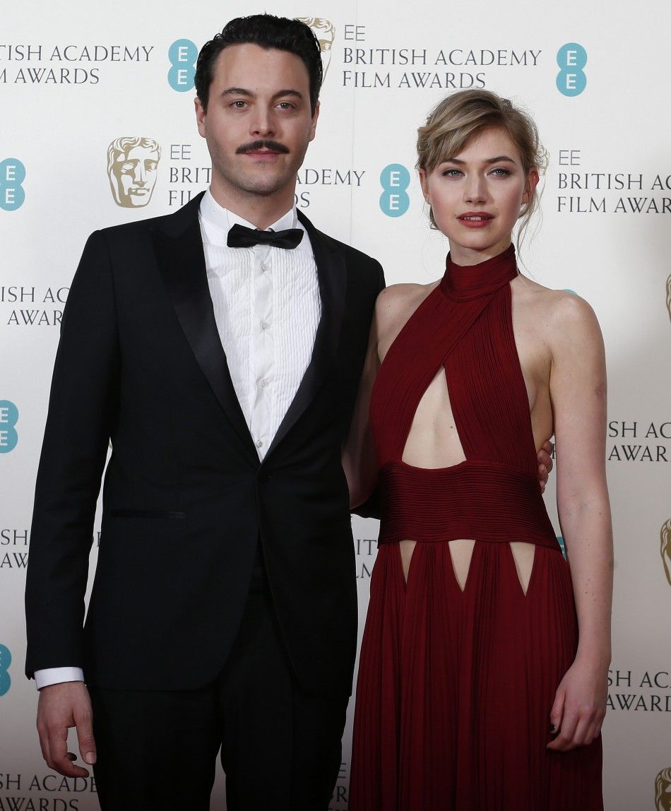 Jack Huston and Imogen Poots pose in the Winners Area at the BAFTA awards ceremony in London