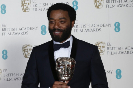 Chiwetel Ejiofor celebrates after winning Best Actor for &quot;12 Years a Slave&quot; at the BAFTA awards ceremony in London