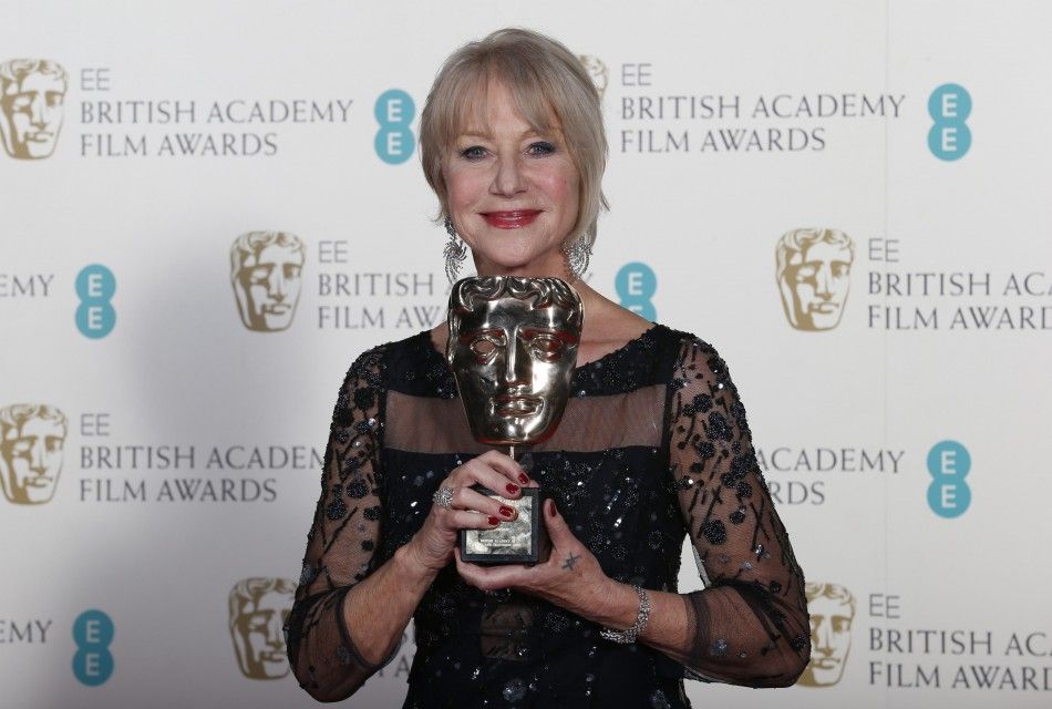 Mirren celebrates winning the Fellowship award at the BAFTA awards ceremony in London