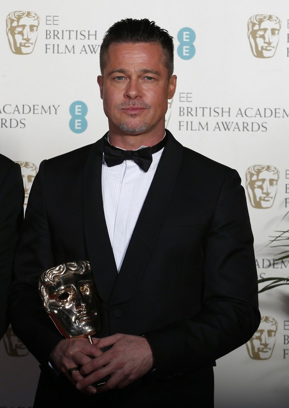 Actor Pitt holds his award after the film quot12 Years a Slavequot won the best film category at the BAFTA awards ceremony in London