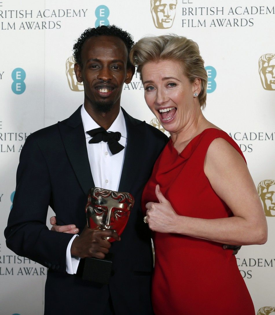 Barkhad Abdi celebrates winning Best Supporting Actor for quotCaptain Phillipsquot with Emma Thompson at the BAFTA awards ceremony in London