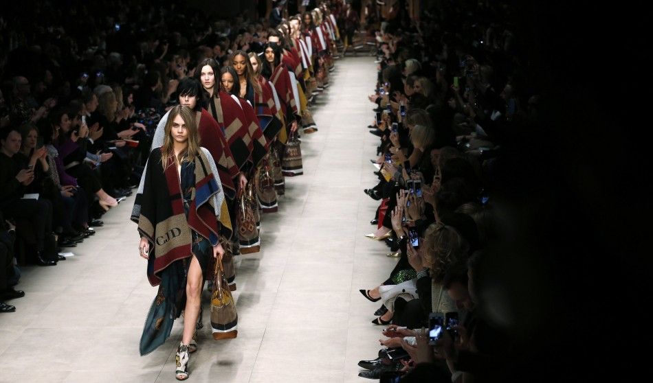 Cara Delevingne leads models as they present creations from the Burberry Prorsum AutumnWinter 2014 collection during London Fashion Week