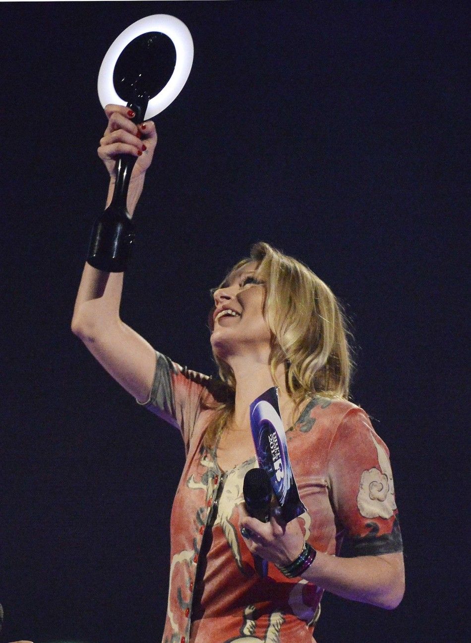 Model Kate Moss accepts the British Male Solo Artist award on behalf of David Bowie at the BRIT Awards in London
