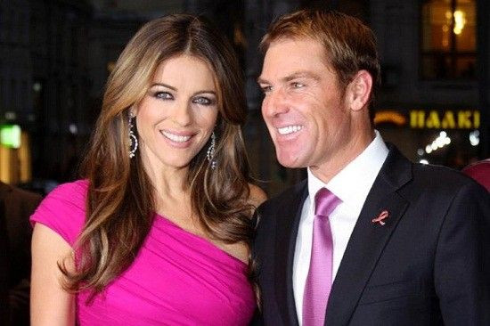 Liz Hurley and Shane Warne/Reuters