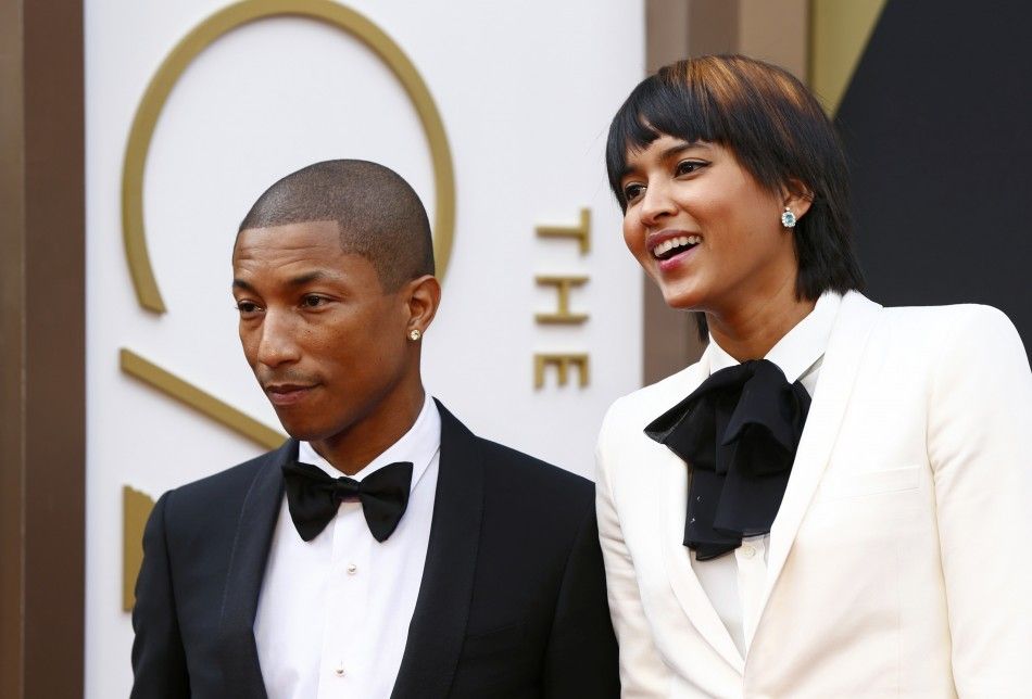 Singer Pharrell WIlliams arrives with wife Helen Lasichanh at the 86th Academy Awards in Hollywood