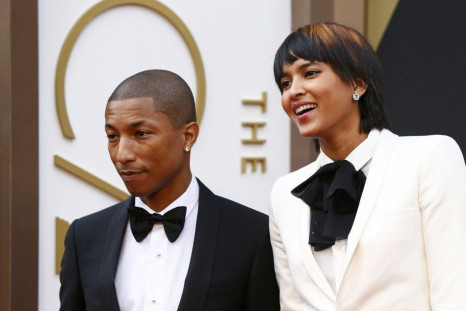 Singer Pharrell WIlliams arrives with wife Helen Lasichanh at the 86th Academy Awards in Hollywood