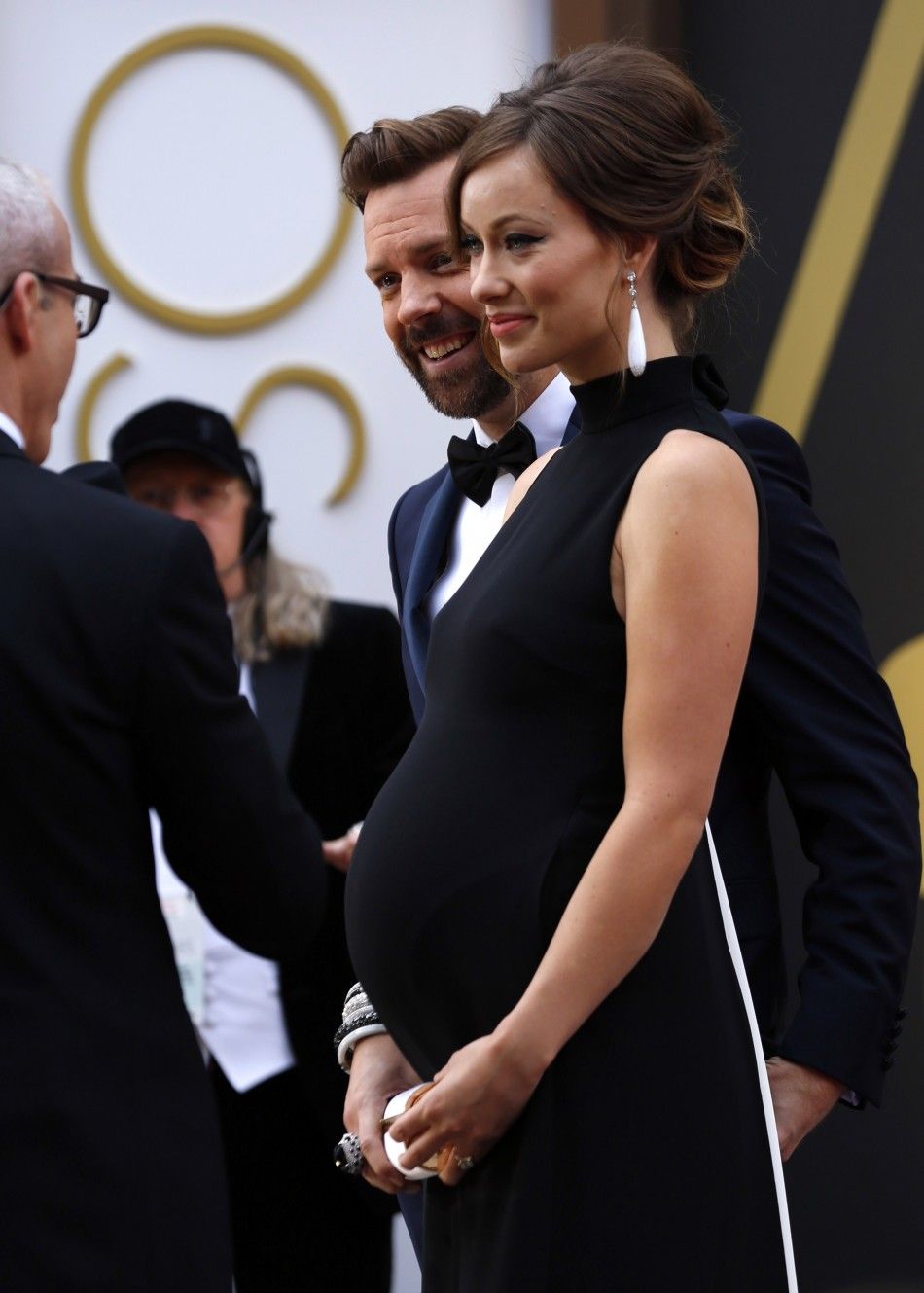 2014 Oscars Red Carpet Pregnant Olivia Wilde and fiance Jason Sudeikis