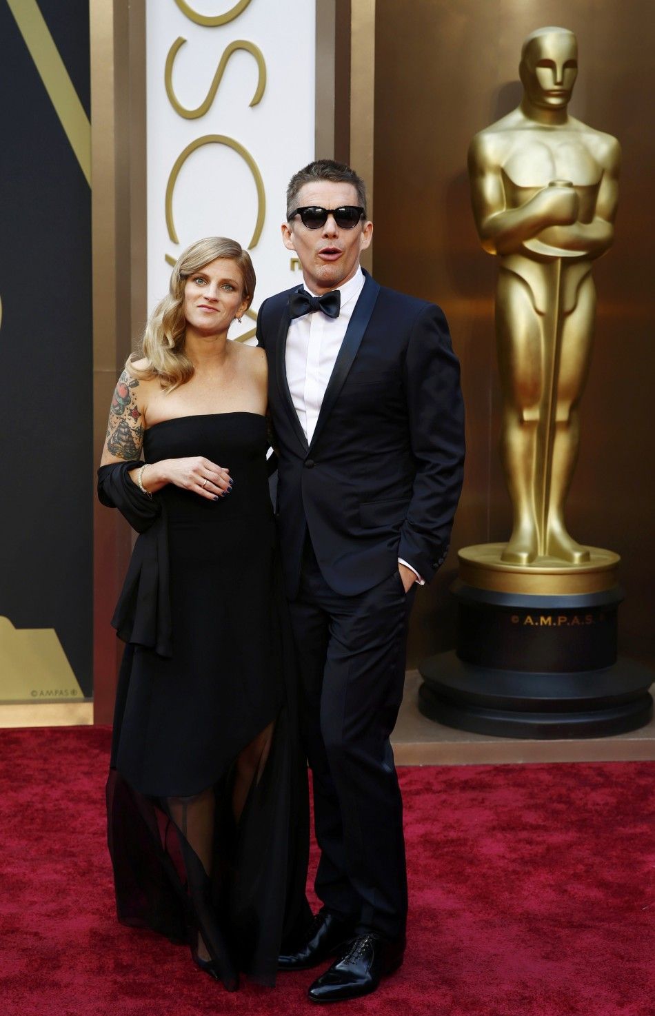 Actor Ethan Hawke and wife Ryan arrive at the 86th Academy Awards in Hollywood