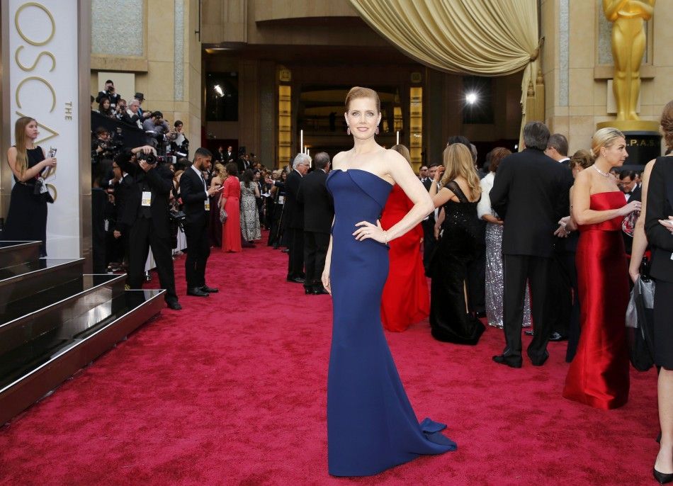 Amy Adams, best actress nominee for her role in quotAmerican Hustlequot, arrives on the red carpet at the 86th Academy Awards in Hollywood