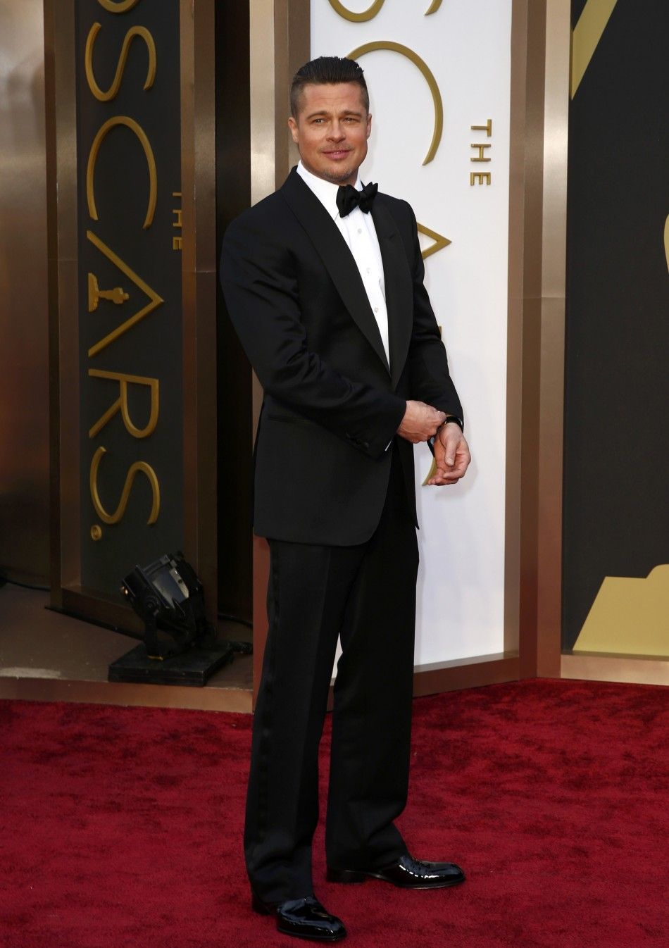Actor Brad Pitt arrive at the 86th Academy Awards in Hollywood