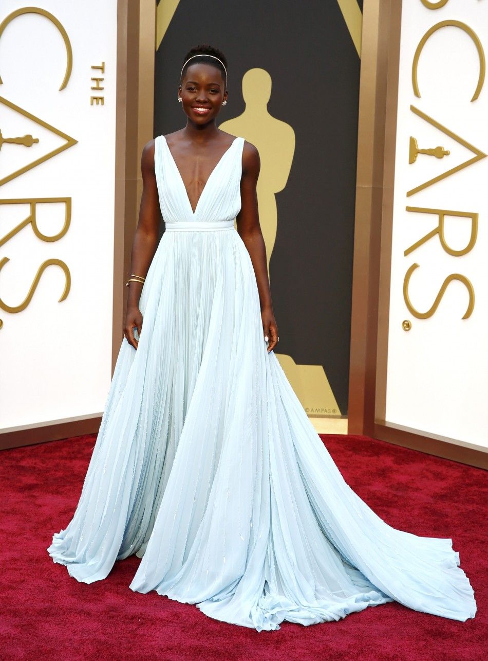 Lupita Nyongo, best supporting actress nominee for her role in quot12 Years a Slavequot and wearing a Prada gown, arrives at the 86th Academy Awards in Hollywood