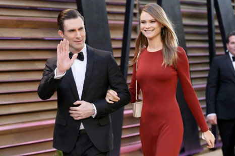 Musician Adam Levine and model Behati Prinsloo arrive at the 2014 Vanity Fair Oscars Party in West Hollywood