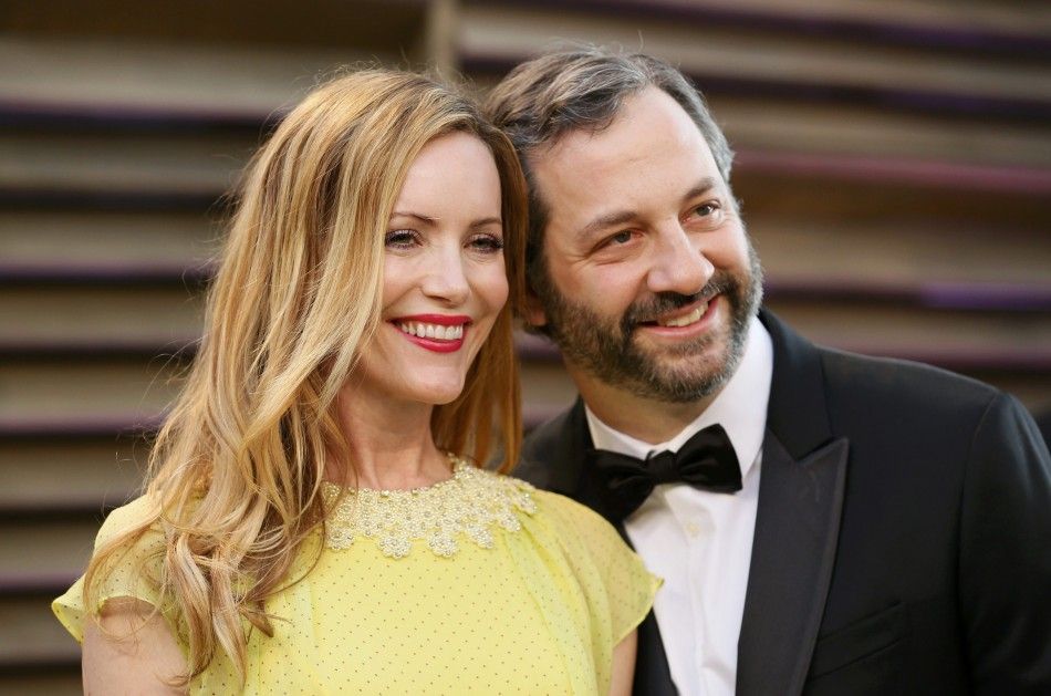 Actress Leslie Mann and her husband, director Judd Apatow arrive at the 2014 Vanity Fair Oscars Party in West Hollywood