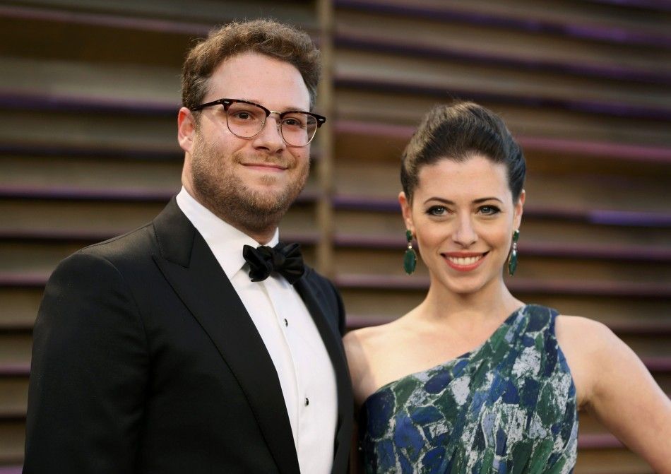 Actor Seth Rogen and his wife Lauren Miller arrive at the 2014 Vanity Fair Oscars Party in West Hollywood
