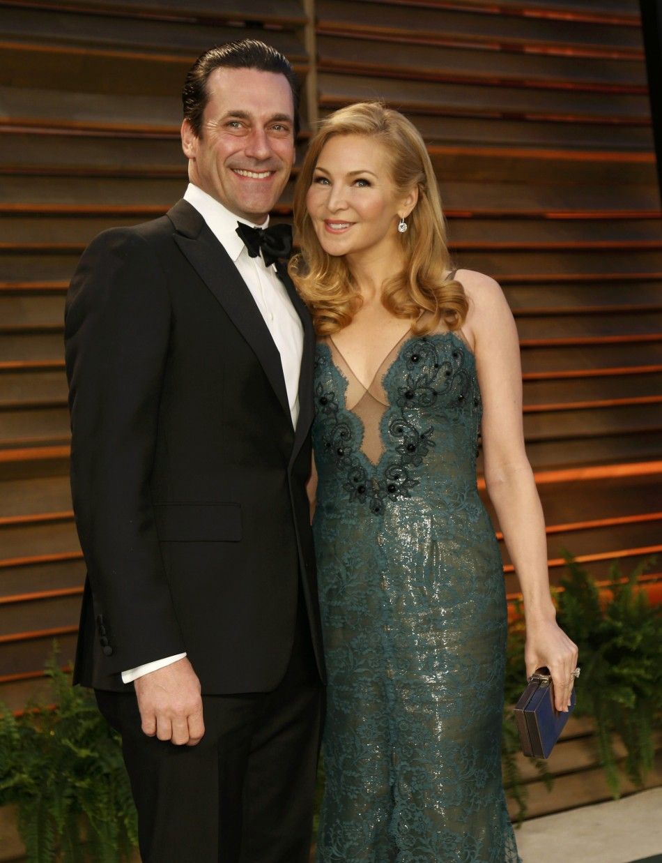Actor Jon Hamm and his wife Jennifer Westfeldt arrive at the 2014 Vanity Fair Oscars Party in West Hollywood
