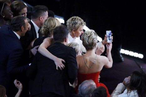 Host Degeneres takes a group picture at the 86th Academy Awards in Hollywood