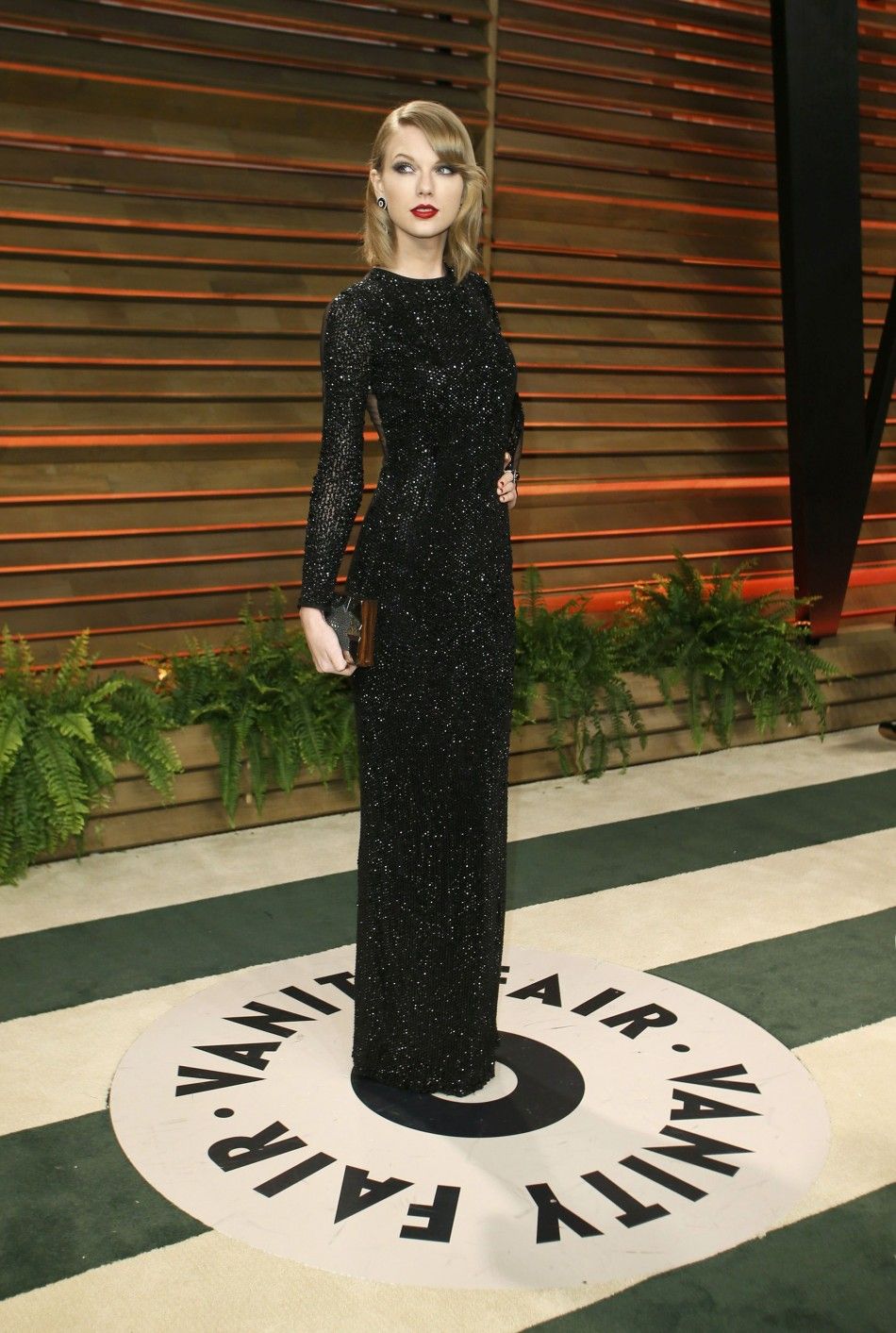Musician Taylor Swift arrives at the 2014 Vanity Fair Oscars Party in West Hollywood